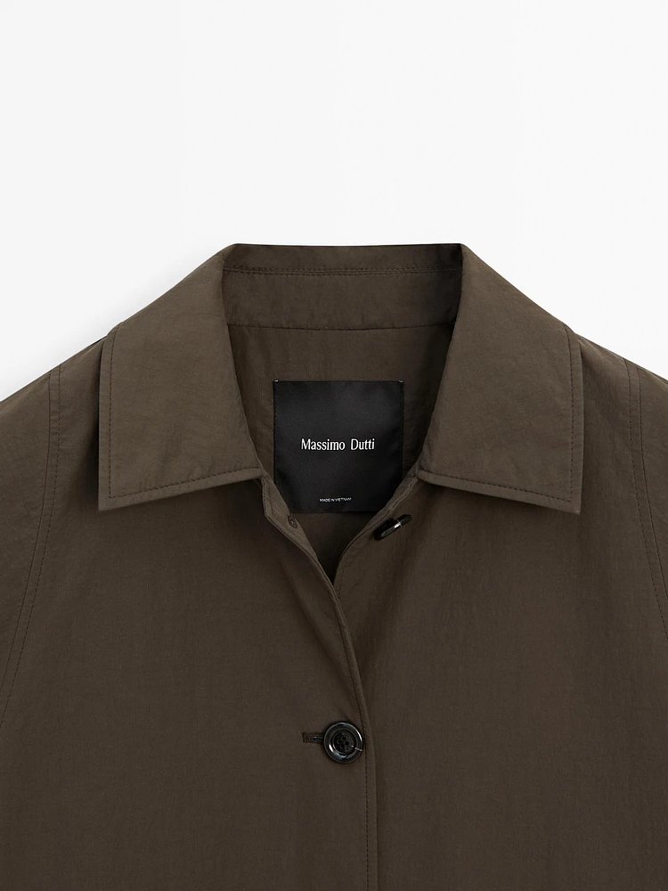 Trench tissu technique boutonnage