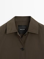 Trench tissu technique boutonnage