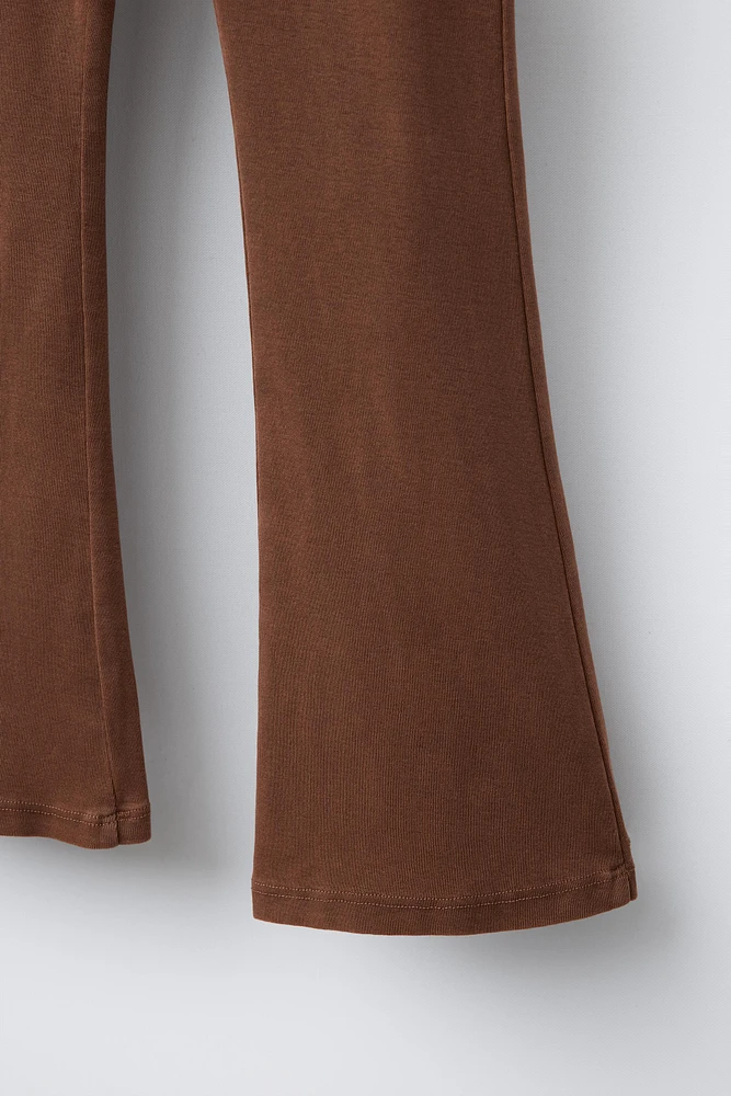 FOLD-OVER WAISTBAND FLARE LEGGINGS WITH EYELETS
