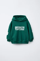SWEAT À CAPUCHE IMPRIMÉ