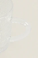 GLASS CUP WITH RAISED DESIGN