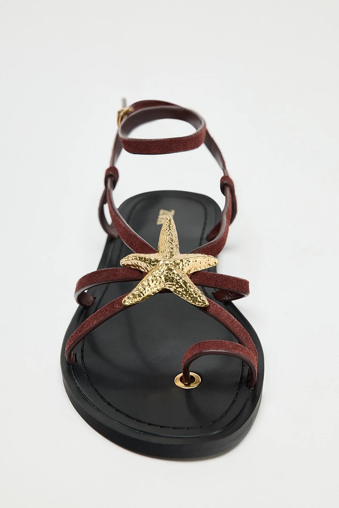 FLAT SUEDE SANDALS WITH METALLIC PIECE
