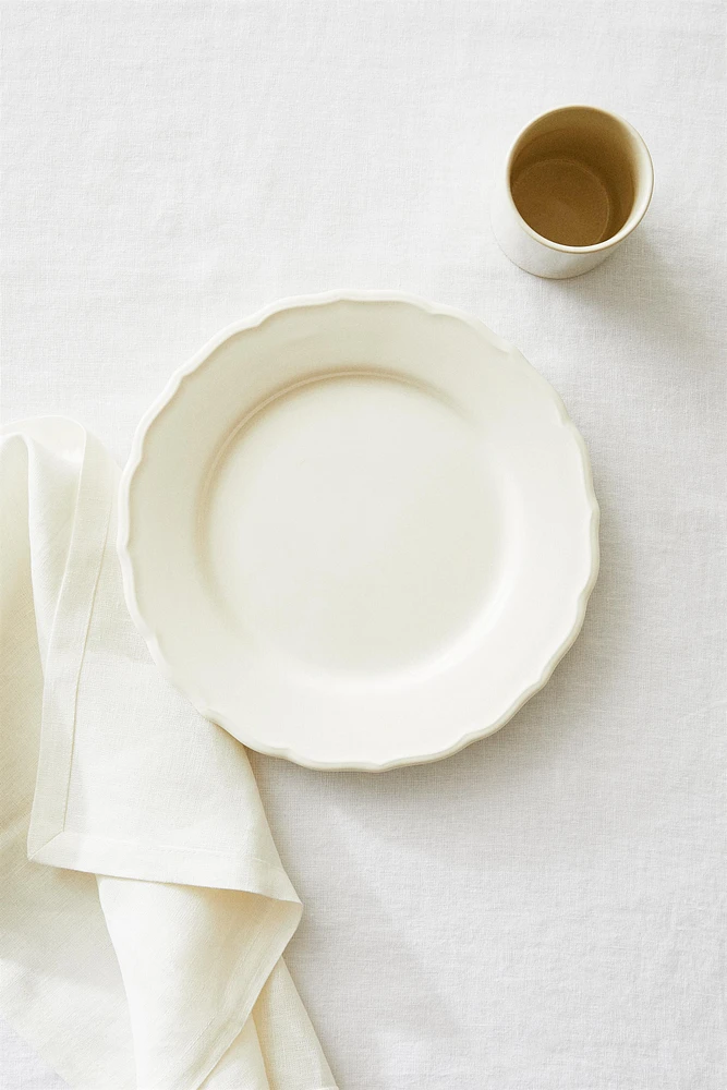 EARTHENWARE DINNER DISH WITH RAISED-DESIGN EDGE