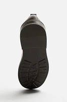 CHAUSSURES EN CUIR HABILLÉES