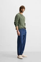 WASHED CABLE-KNIT SWEATER