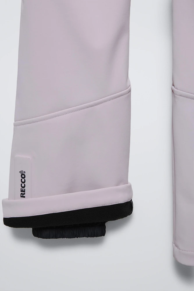 COMBINAISON DE SKI EN PLUMES COUPE-VENT ET DÉPERLANTE RECCO® SYSTEM