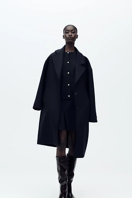 GILET EN MAILLE À BOUTONS DORÉS