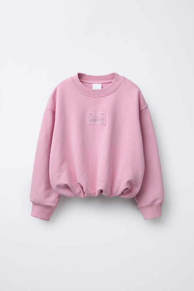 LABEL DETAIL BALLOON-HEM CROPPED SWEATSHIRT