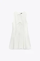 ROBE COURTE LACETS GODETS