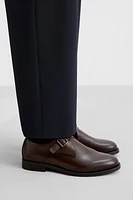 CHAUSSURES EN CUIR À BOUCLE