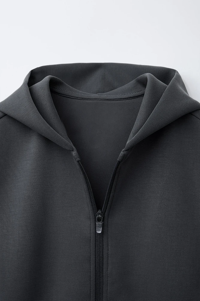 GILET À CAPUCHE SPORT