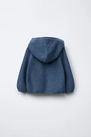 GILET EN MAILLE À CAPUCHE
