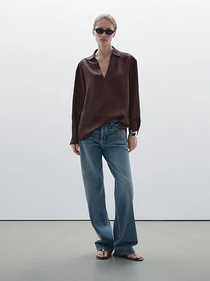 Flowing shirt featuring long sleeves with vents