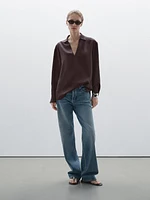 Flowing shirt featuring long sleeves with vents
