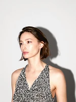 Top drapé en maille chinée