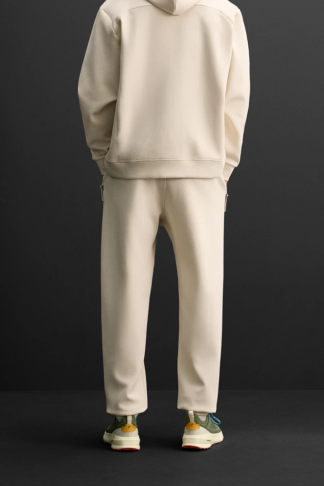 TECHNICAL ZIPPER JOGGER PANTS