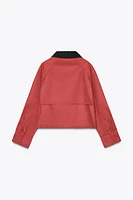 VESTE CIRÉE À COL EN MATIÈRES VARIÉES