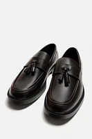 MOCASSINS CHICS À POMPONS