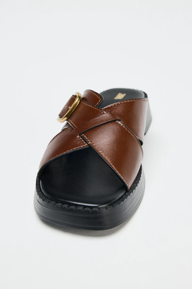 LEATHER CRISS CROSS BUCKLE SANDALS