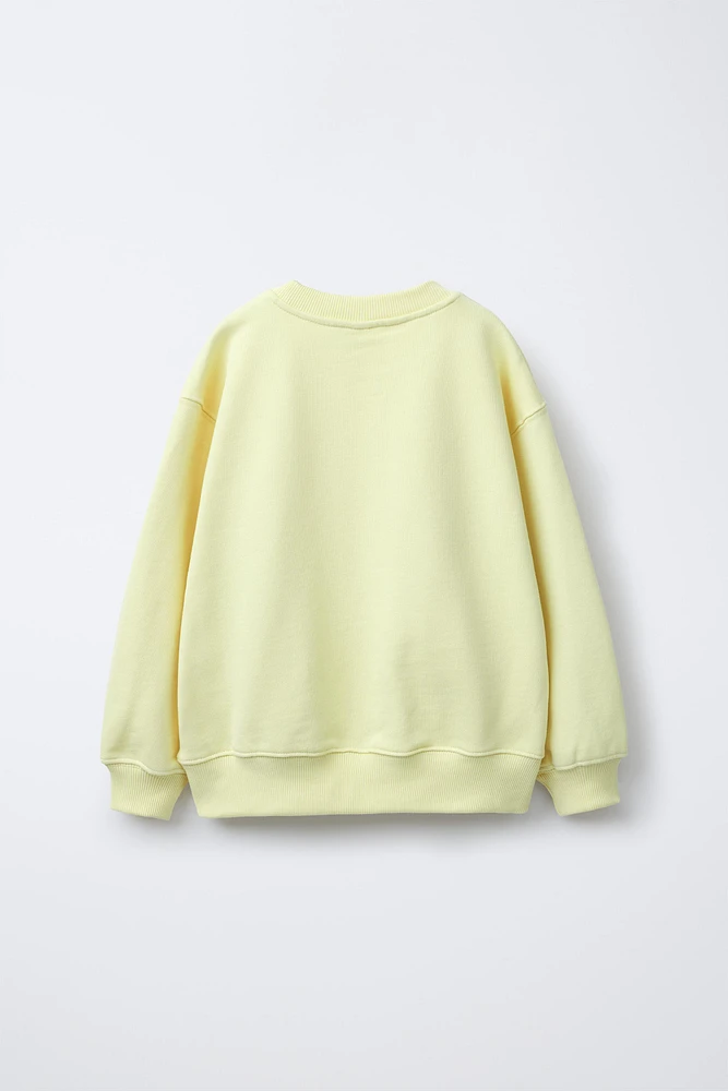 SWEAT FLEUR EN RELIEF