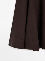 Flared linen skirt with hem detail