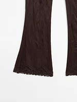 Capri trousers with blonde lace detail