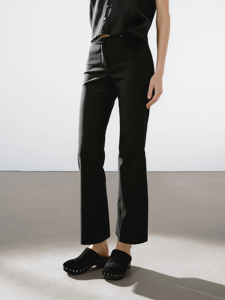 Flared trousers with waist detail