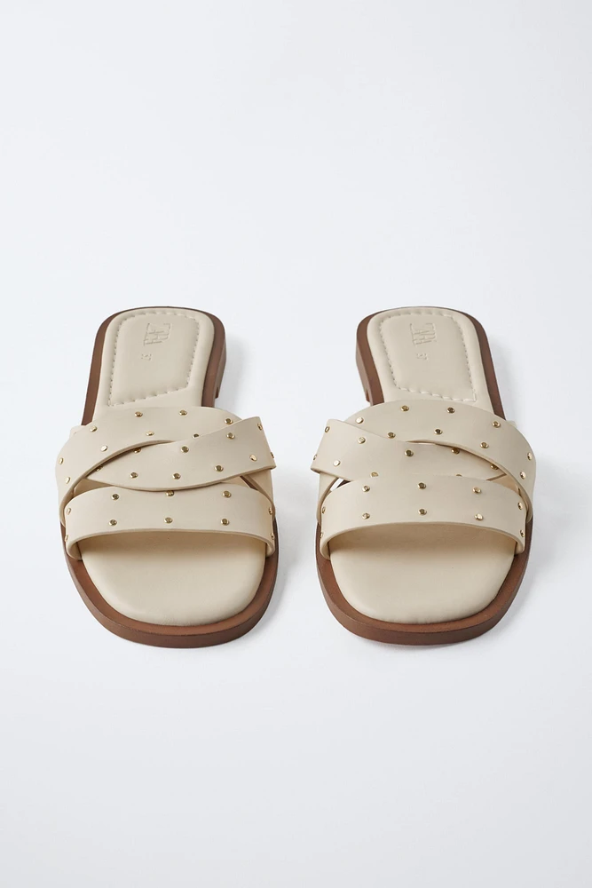 STUDDED CROSSOVER FLAT SANDALS