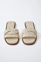 STUDDED CROSSOVER FLAT SANDALS