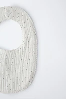 TEXTURED WEAVE BIB WITH STARS