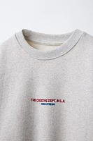 HEATHERED TEXT SWEATSHIRT