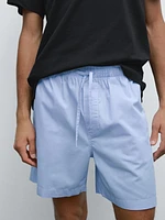 Short sleeve pyjama top and striped trousers