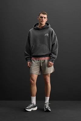 SWEAT À CAPUCHE IMPRIMÉ