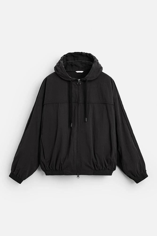 HOODED TECHNICAL JACKET