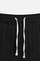 WRINKLED EFFECT JACQUARD BERMUDA SHORTS