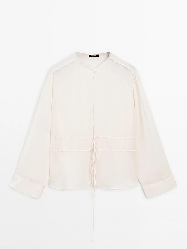 Flowing semi-sheer blouse with ties