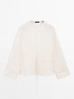 Flowing semi-sheer blouse with ties