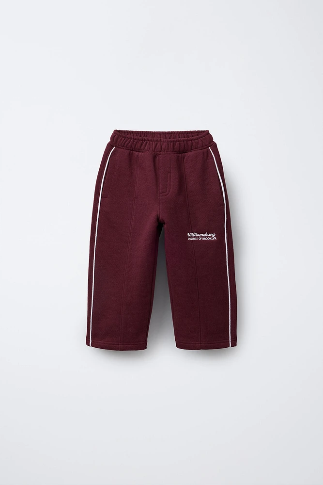 STRAIGHT PLUSH TEXT PANTS