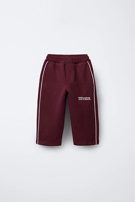 STRAIGHT PLUSH TEXT PANTS