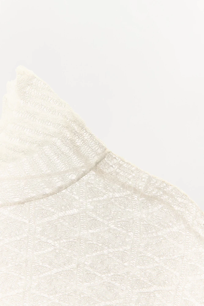 CAPE EN MAILLE TRICOT