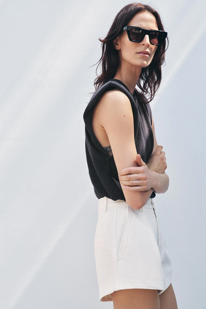 WASHED EFFECT T-SHIRT WITH SHOULDER PADS
