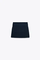 MINI JUPE EN MAILLE AVEC CEINTURE