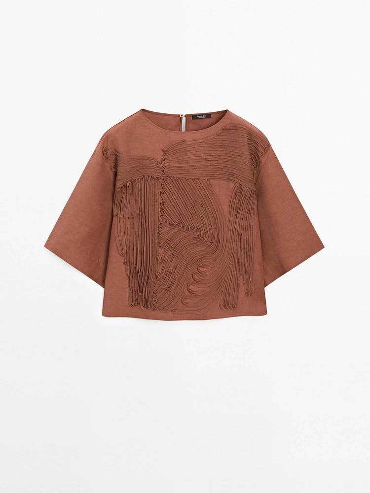 Flowing top with embroidered detail
