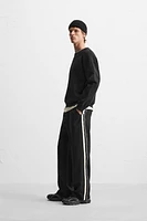 TECHNICAL PANTS WITH BANDS