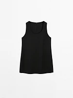 Long sleeveless satin blouse