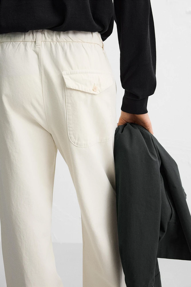 RELAXED FIT PLEATED PANTS