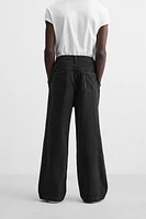 PLEATED BAGGY JEANS