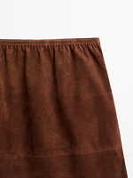 Jupe droite en cuir finition daim