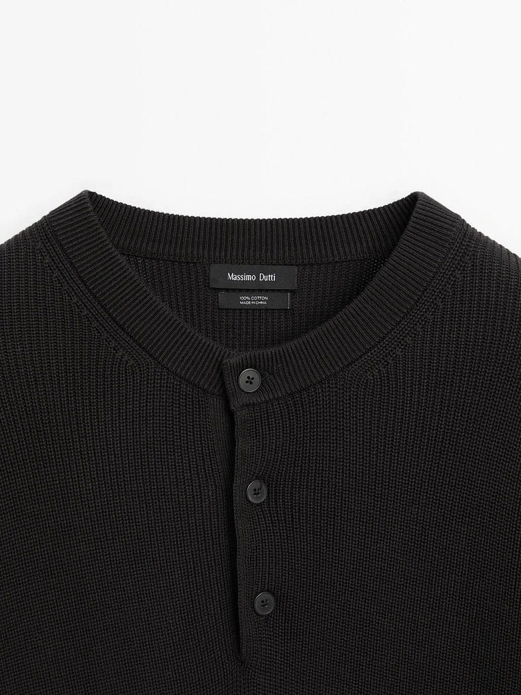 Cotton knit sweater with buttoned neck