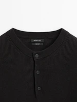Cotton knit sweater with buttoned neck